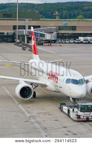 ZURICH, SWITZERLAND - CIRCA OCTOBER, 2018: an Swiss aircraft on pushback at Zurich International Airport.