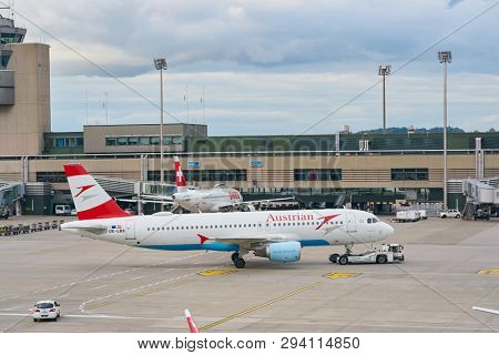 ZURICH, SWITZERLAND - CIRCA OCTOBER, 2018: an Austrian Airlines aircraft on pushback at Zurich International Airport.