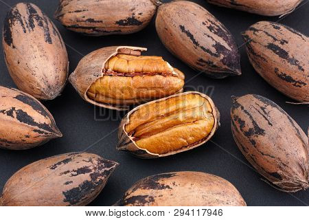 Pecan Nuts On A Black Background. Cllose Up.