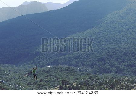 Woman Balancing On The Rope Concept Of Risk Taking And Challenge.