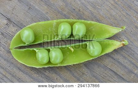 Opened Green Pod With Peas Inside Close-up