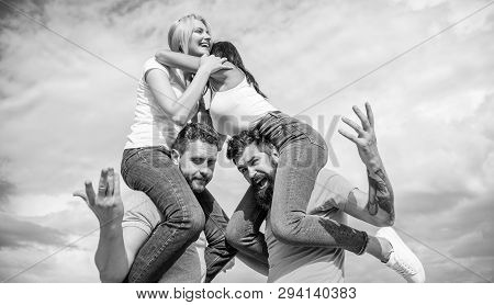 Twice Fun On Double Date. Friendship Of Families. Couples In Love Having Fun. Men Carry Girlfriends 