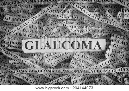 Glaucoma. Torn Pieces Of Paper With The Words Glaucoma. Concept Image. Black And White. Close Up.