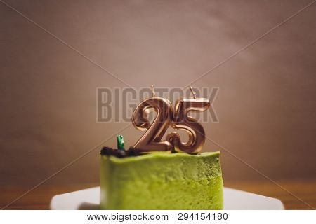 Twenty Five Years Anniversary. Birthday Chocolate Cake With White Burning Candles In The Form Of Num