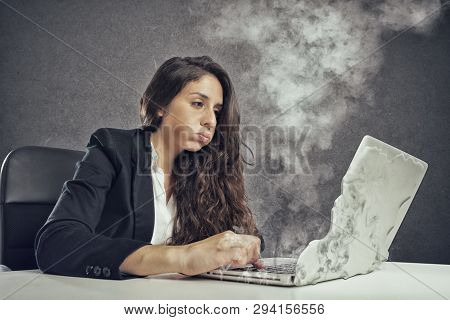 Woman Stressed By Overwork With The Laptop Melting