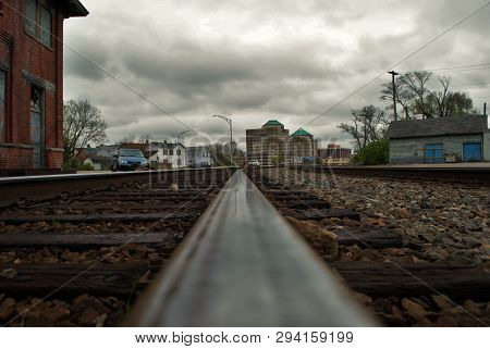 Abandoned Brick Train Depot With Tracks And Graffiti