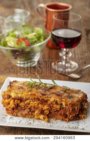 Greek Pastizio Noodle Dish With Cheese On Wood