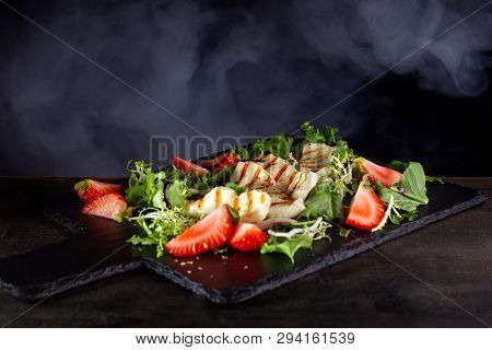 Salad With Grilled Halumi With Strawberries And Arugula.