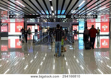 Guangzhou, China - Mart 10, 2019: Chinese People And Foreign Travelers Walking In Terminal Of Guangz