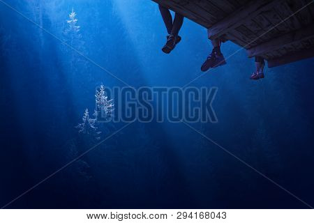 People Are Sitting On The Balcony In A Deep Misty Firest. Travel Concept.
