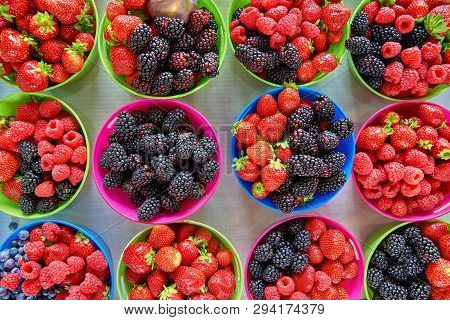 Fresh Boxes Of Assorted Berries On Display At The Farmers Market