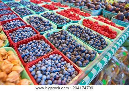Fresh Boxes Of Assorted Berries On Display At The Farmers Market