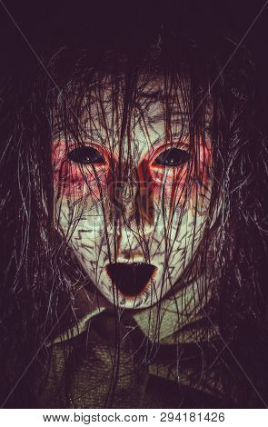 Scary Infernal Cursed Girl With Black Eyes Opened Mouth And Cracked Skin Close-up Portrait. Creepy D
