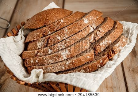 Bread In Wooden Breadbox On The Wooden Table