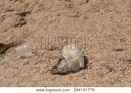 Pollution Of The Ocean, Sea And Nature. Rubbish On The Beach. Plastic Contamination. Ecological Cata