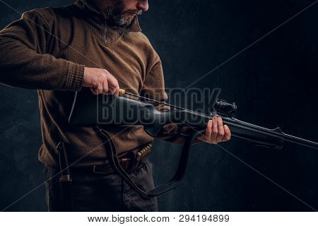 Opening Of The Spring Hunting Season. A Man Cleans Rifle Barrel, Maintenance Before Hunting. Closeup