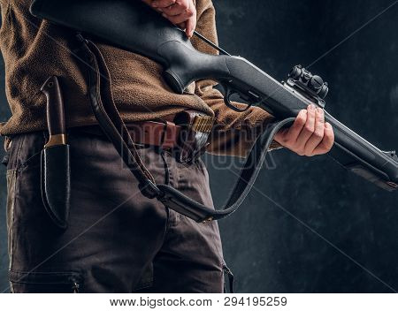Opening Of The Spring Hunting Season. A Man Cleans Rifle Barrel, Maintenance Before Hunting. Closeup
