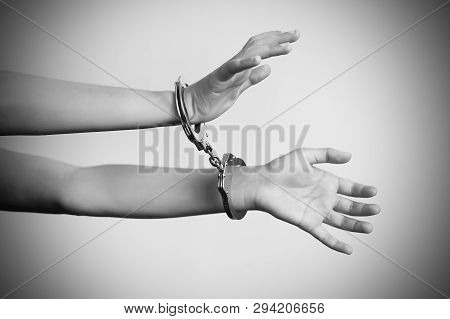 Arrested Woman Handcuffed Hands. Prisoner Or Arrested Terrorist, Close-up Of Hands In Handcuffs Isol