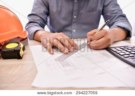 Engineering Concept. The Engineer Is Working In The Office. Engineers Are Designing Their Work Calcu