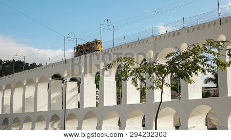Santa Teresa Tram Crossing Lapa Arches In Rio De Janeiro