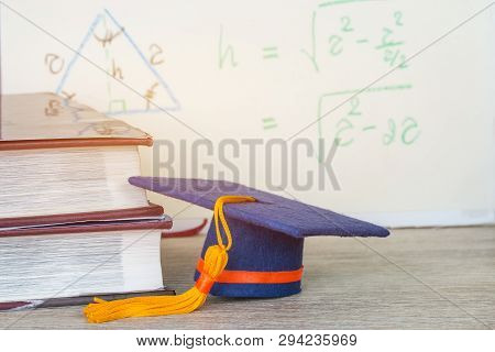 Graduation Cap On Stacks Document Report And Business Busyshow Success In Education Learning Study I
