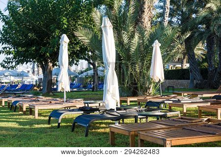 Sunbeds and umbrellas, Alykes beach, Kato Paphos, Cyprus