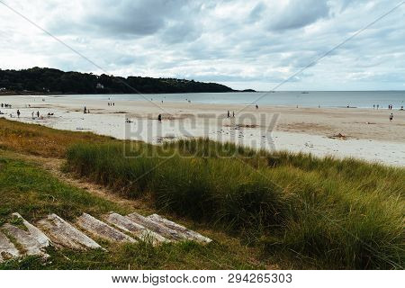 Tranquil Beach Against Cloudy Sky In Brittany