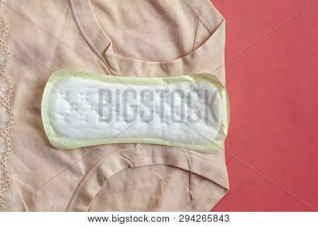 Menstruation Sanitary Pads For Woman Hygiene Protection On Plaid At Home. Protection For Woman Criti