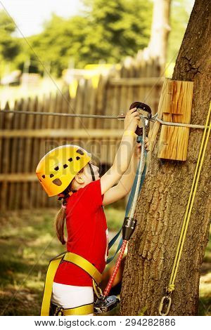 Little Brave Caucasian Girl Treerunner Fasten The Rollclip Before Climbing