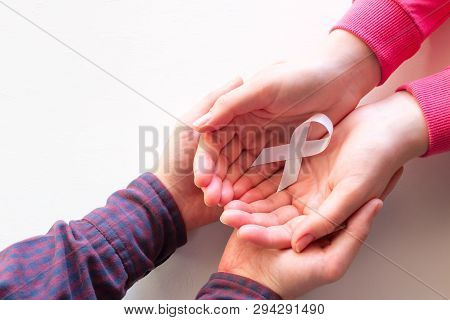 Man And Woman Hold White Ribbon Close Up