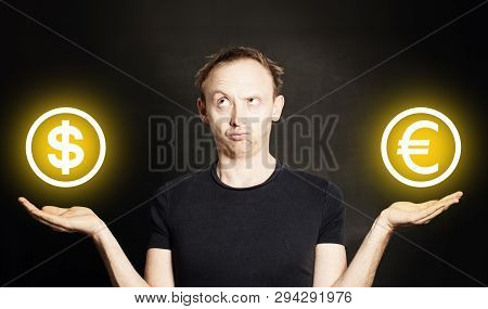 Man Choosing Usa Dollar Or Es Euro Currency On Blackboard Background, Investments Concept