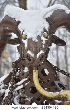 Bronze Capricorn Figure In Snow, Metal Sculpture In The Snow