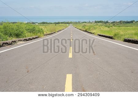 road at green paddy farm in the countryside