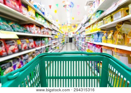 Closeup Shopping Basket Green Color With Blurred Suppermarket Background