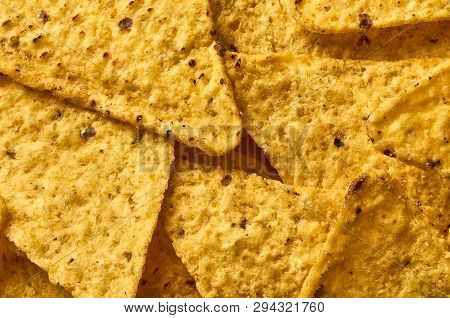 Background Yellow Triangular Corn Nachos With Seasonings
