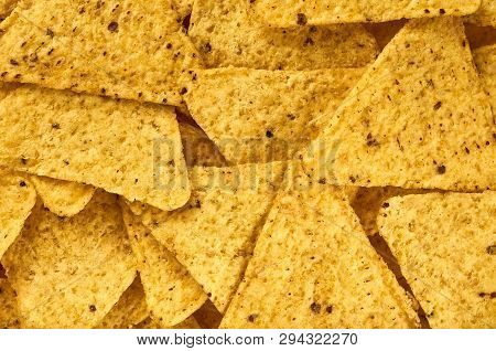 Background Yellow Triangular Corn Nachos With Seasonings