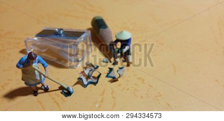 Photo Man And Woman Cleaning Trash From Pencil Sharpener With Negative Space