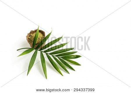 Henna Powder For Dyeing Hair And Eyebrows And Drawing Mehendi On Hands, Isolate With Green Palm Leaf