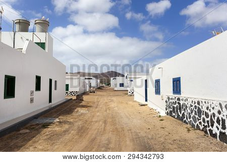 Empty Street With Sand And White Houses In Caleta De Sebo On The Island La Graciosa Of Lanzarote