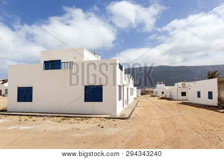 Empty Street With Sand And White Houses In Caleta De Sebo On The Island La Graciosa Of Lanzarote
