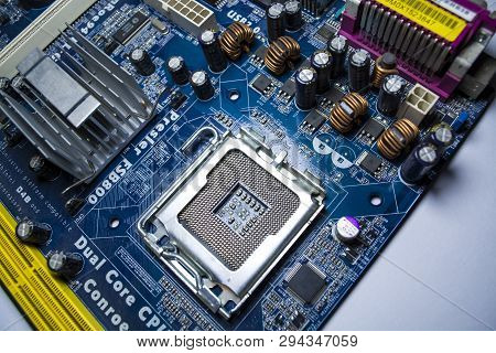 Zelenodolsk, Ukraine. 5.01.2019. The Old Motherboard From The Computer Of Blue Color. Texture. Spare