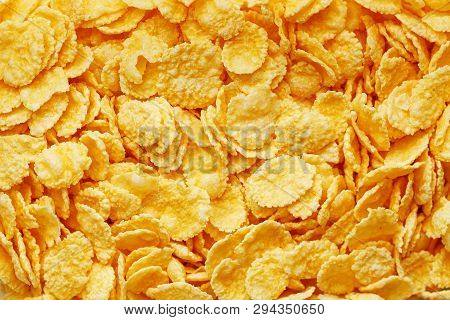 Golden Cornflakes Background And Texture. View From Above. Cornflakes Healthy Breakfast
