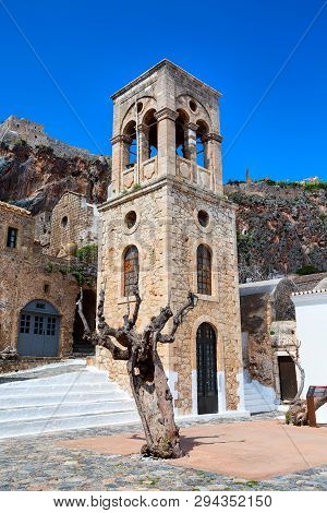 Monemvasia, Greece Street Panorama With Old Houses And Elkomenos Christos Church In Ancient Town, Pe