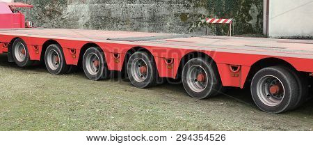 Long Blue Truck With Six Pairs Of Wheels For Exceptional Transport