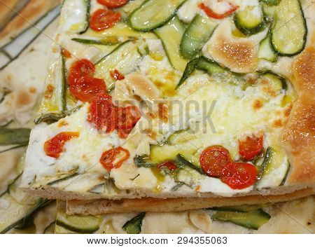 Many Focaccia With Fresh Tomato Zucchini And Mozzarella Cheese For Sale In The Kiosk Of Street Foods