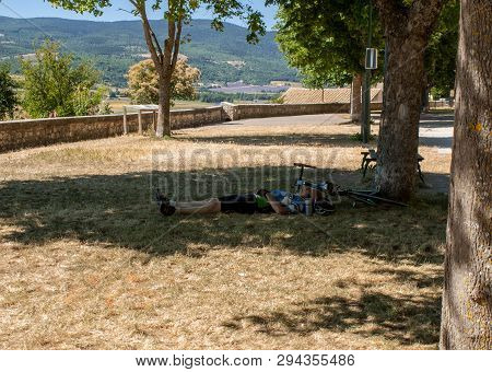 Sault, France - June 25, 2016: Cyclist Resting In The Shade Of A Tree In Sault. Provence, France