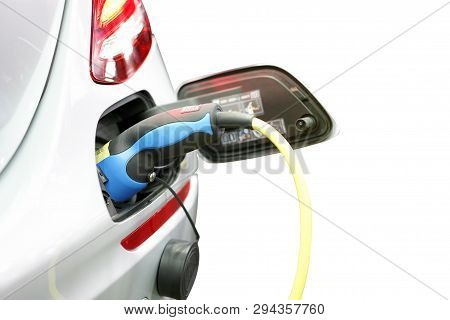 Plug Of Power Cable Electric Supply During Charging At Ev Car (electric Vehicle Charging) Isolated O