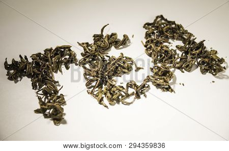 Inscription Tea From Green Tea Leaves On A White Background