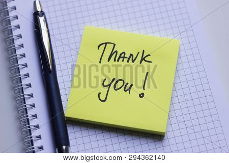 Yellow Sticky Note On White Notepad With The Words Thank You