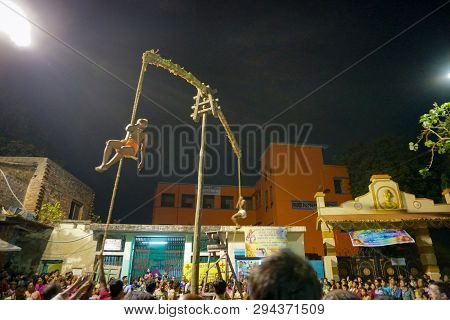 Kolkata, West Bengal, India - 15 April 2018: Two Hindu Devotees Are Hanging From Pole In Air, At Nig